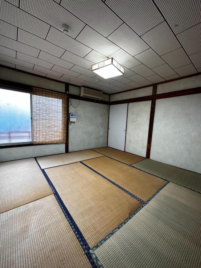 素泊まり民宿とみや Oshima Extérieur photo
